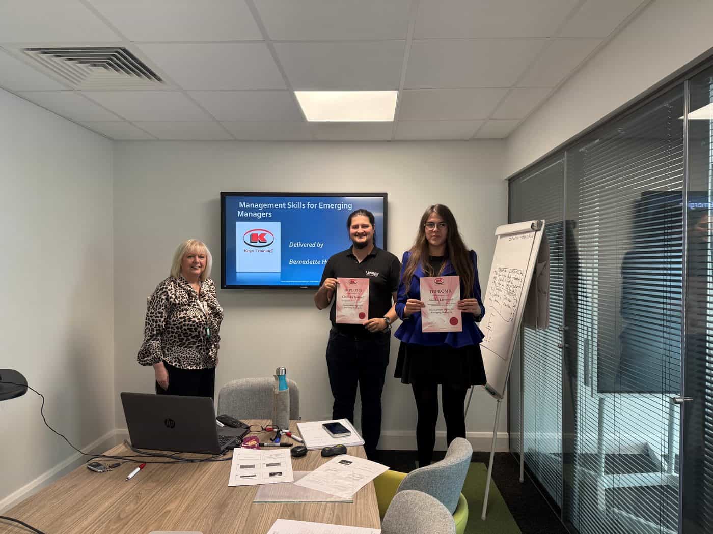 Attendees receiving their Management Skills for Emerging Managers certificates