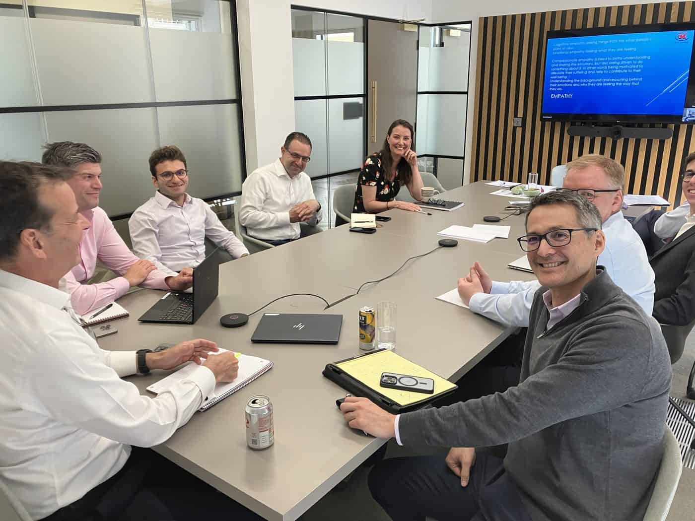 Management training session in a client boardroom