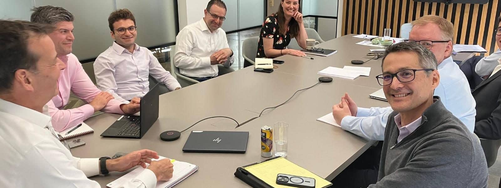 A senior leadership team in a facilitated boardroom session